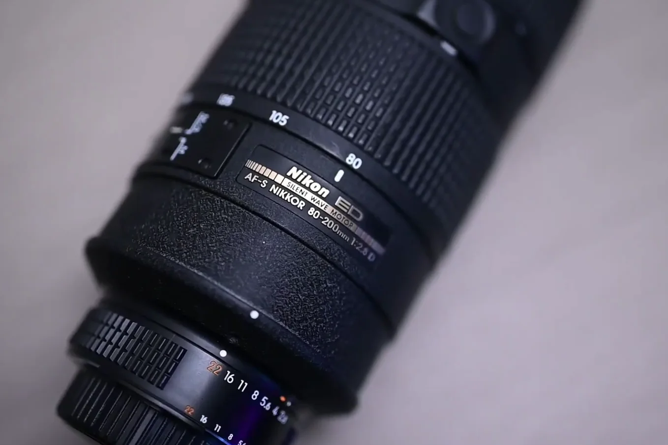 Close up of the Nikon ED and Silent Wave Motor gold plate on the lens barrel