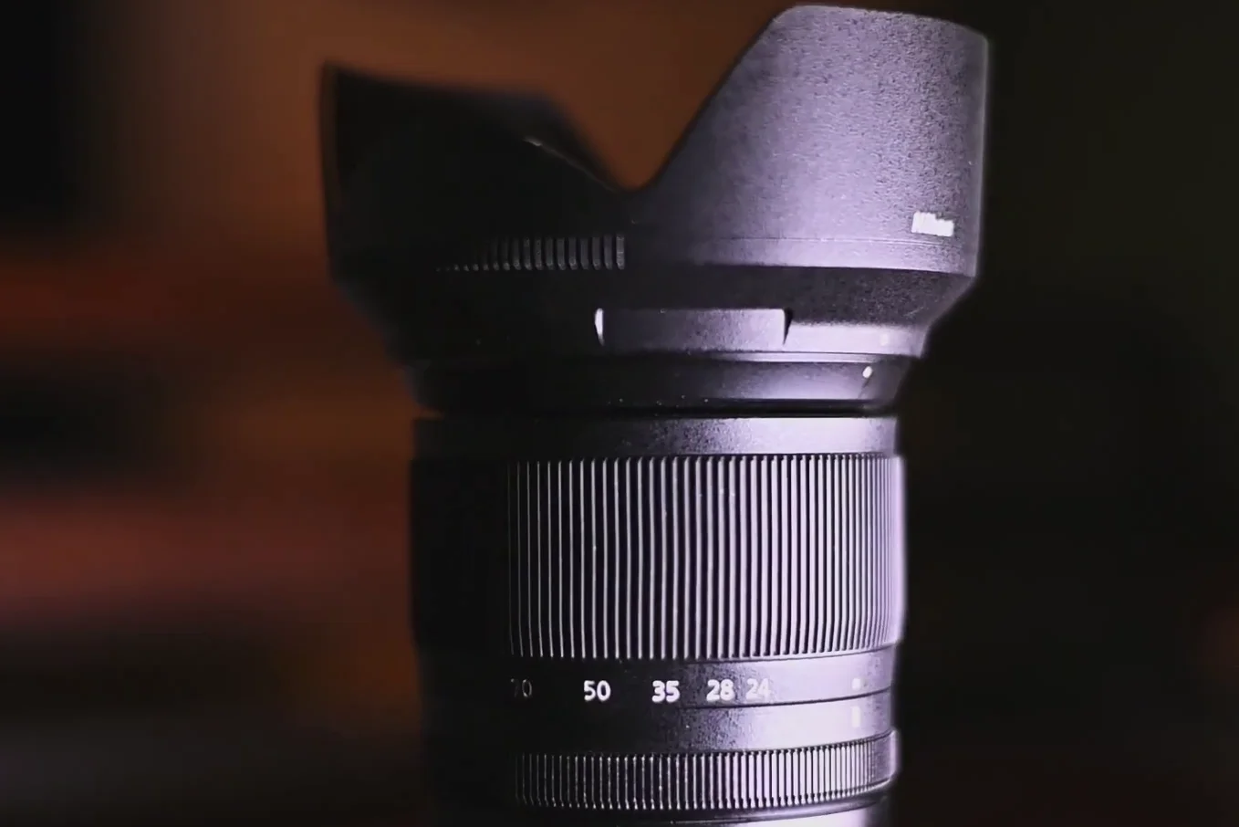 Close up of the Nikon Z 24-70mm f/4 lens barrel showing focal lengths