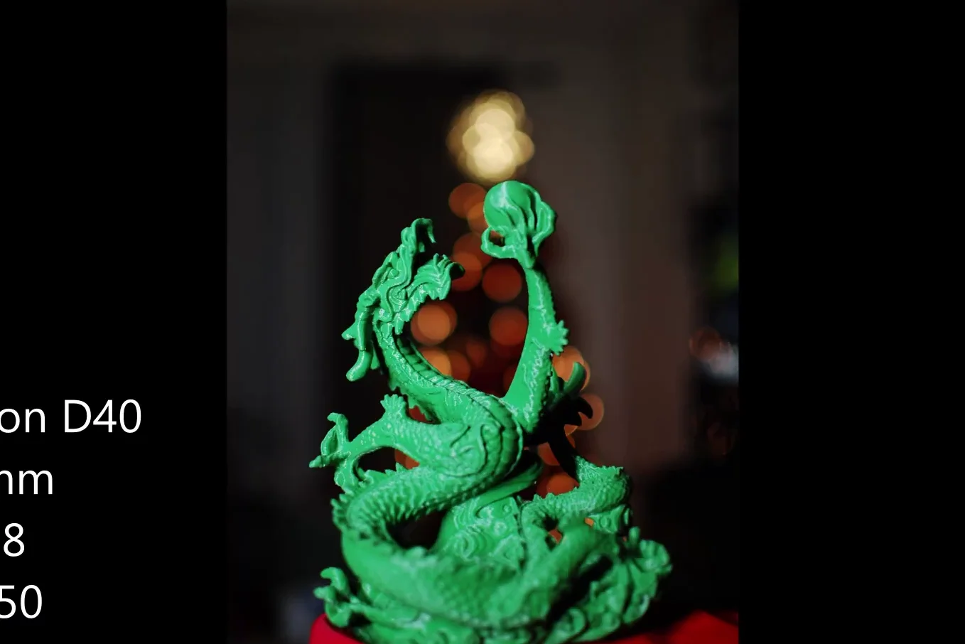 Green dragon statue photography sample with dark background