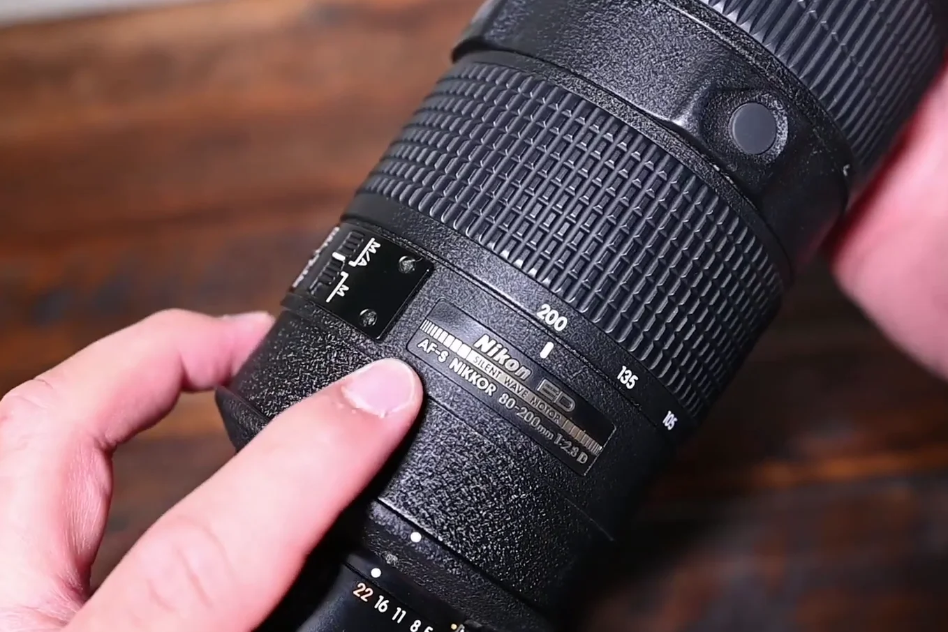Nikon D5000 with a large telephoto lens attached showcasing compatibility