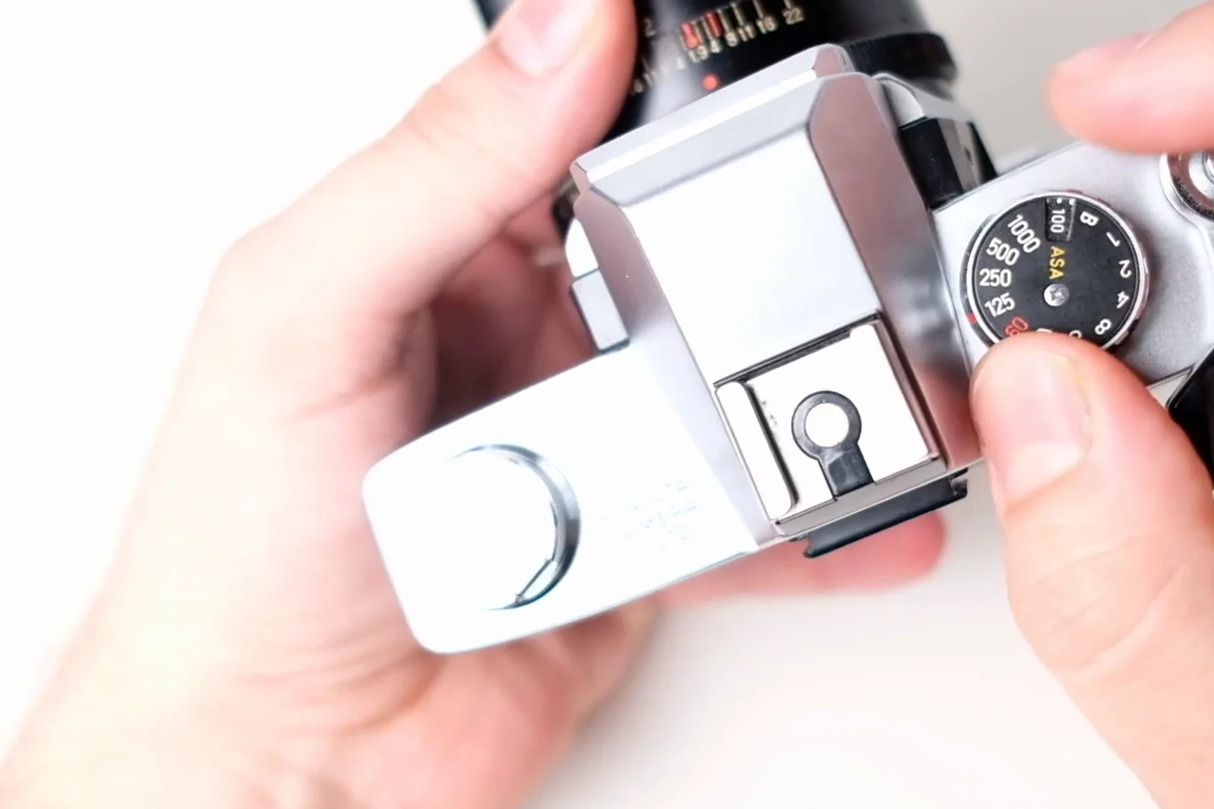 Top plate of the Minolta SRT 102 showing shutter dial and frame counter